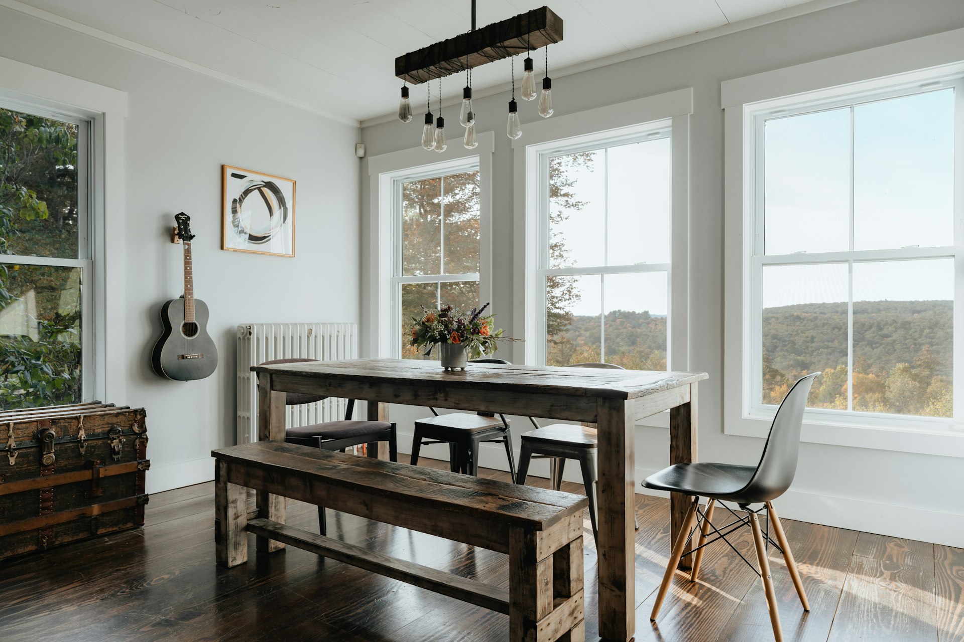 a dining room with a table and a bench
